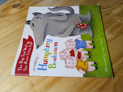 The big sad wold and the mean little pigs as told by Humphrey Bookworm (2017)